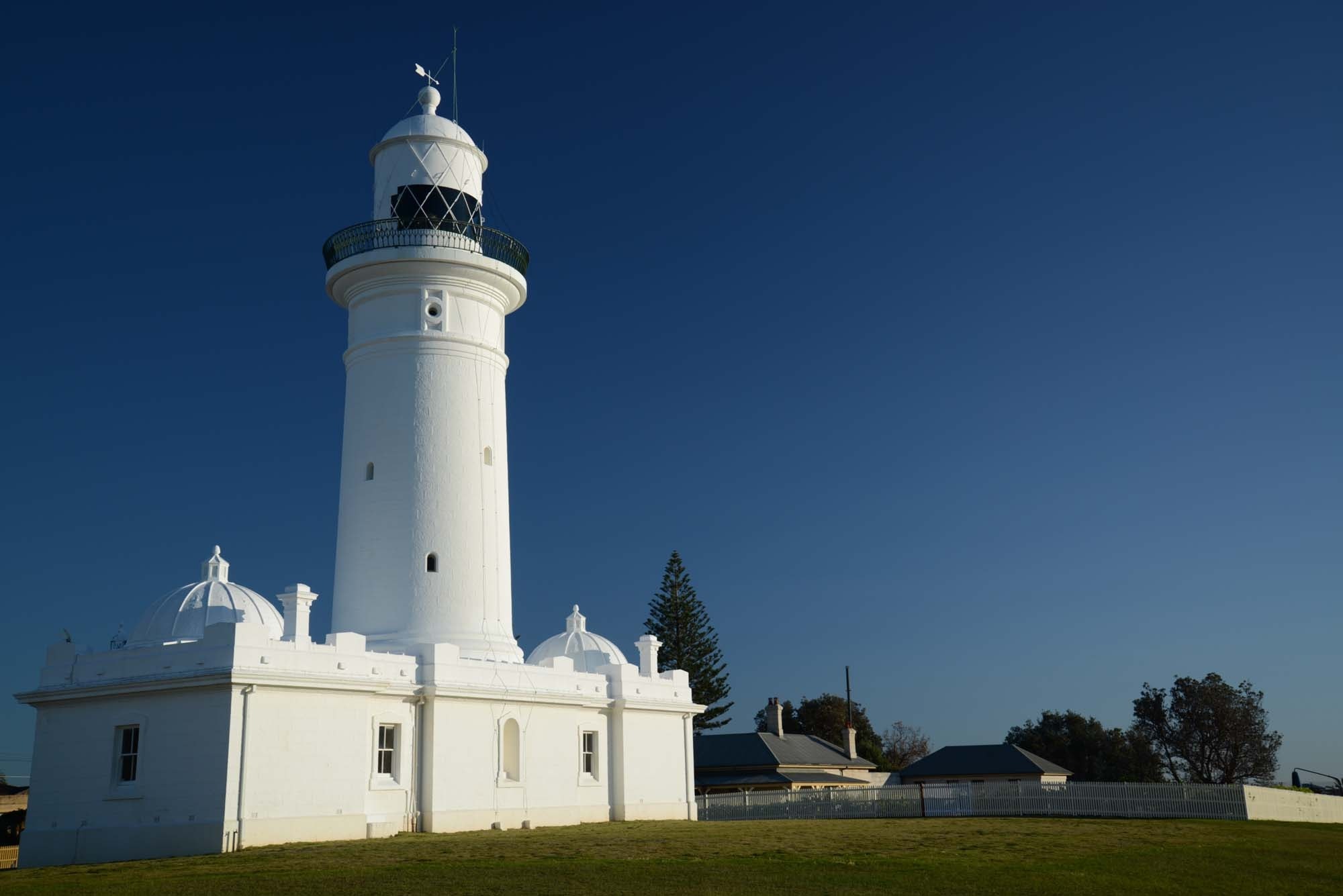 white painted concrete building with tower