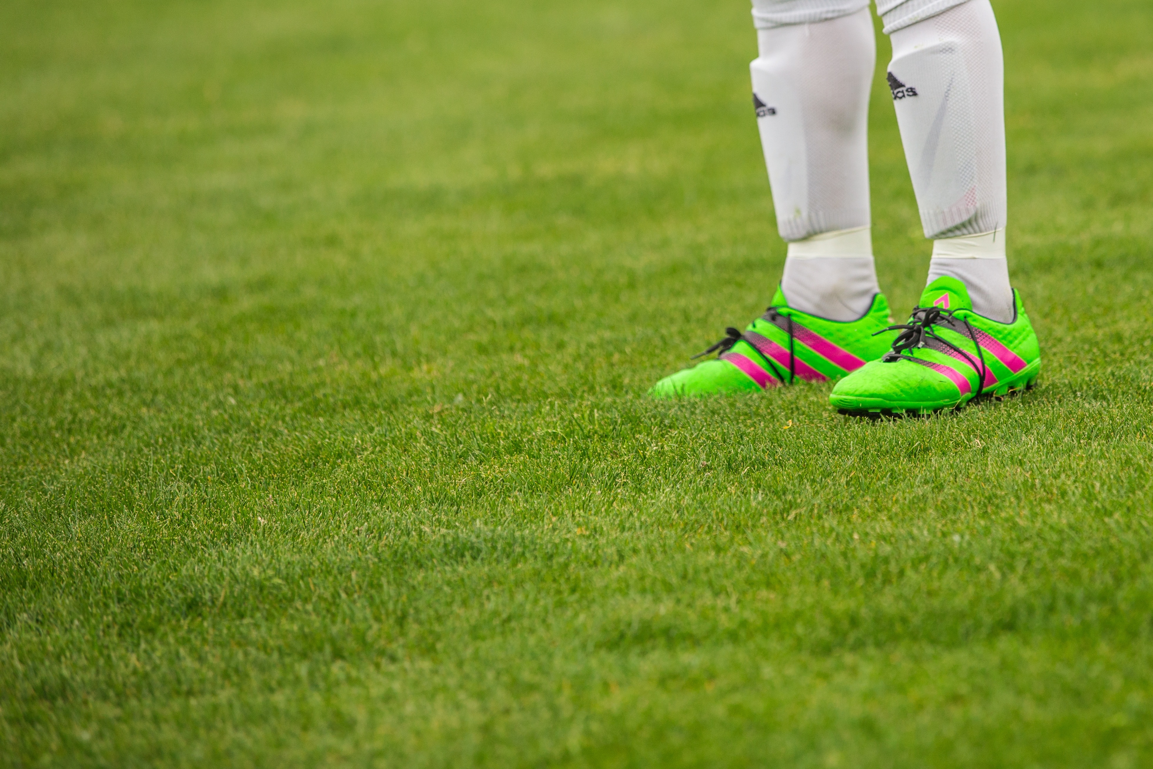 green and pink adidas cleats