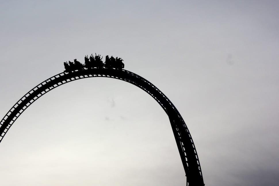 silhouette of people on roller coaster preview
