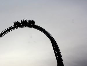 silhouette of people on roller coaster thumbnail