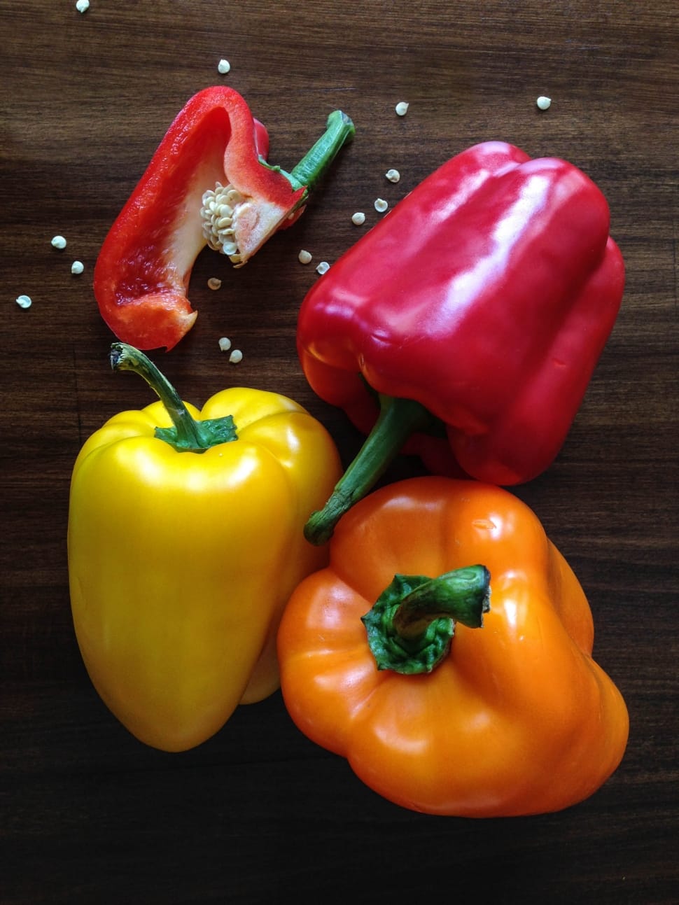 red yellow and orange bell peppers preview