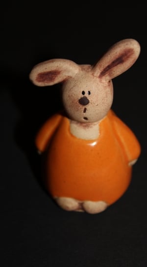 orange and white ceramic rabbit figure thumbnail