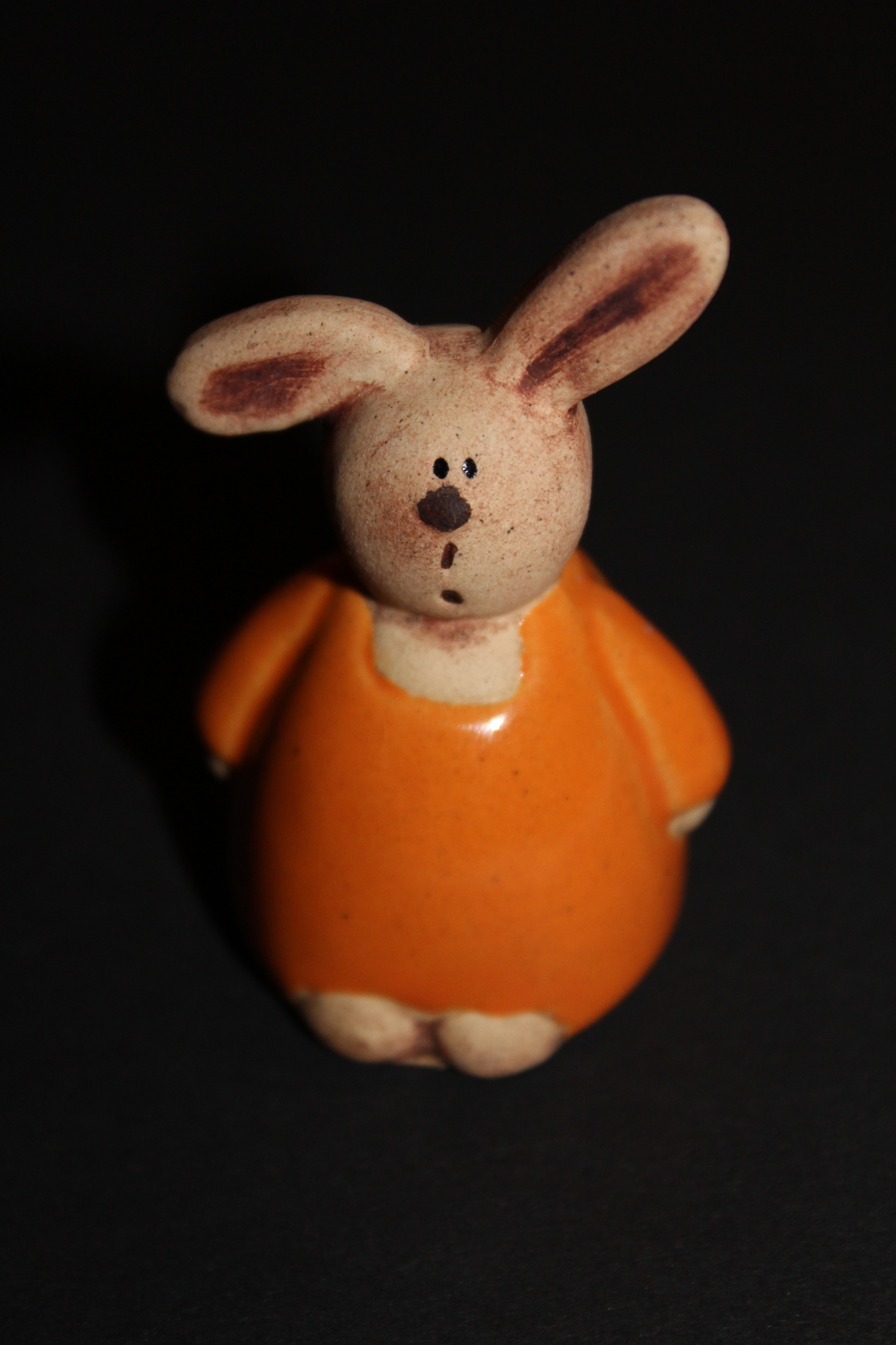 orange and white ceramic rabbit figure