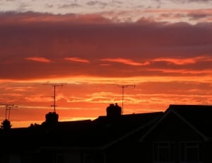 silhouette photography of establishment antenna during sunset thumbnail