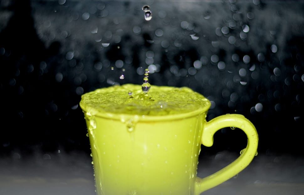 yellow ceramic mug with flowing water timelapse photography preview