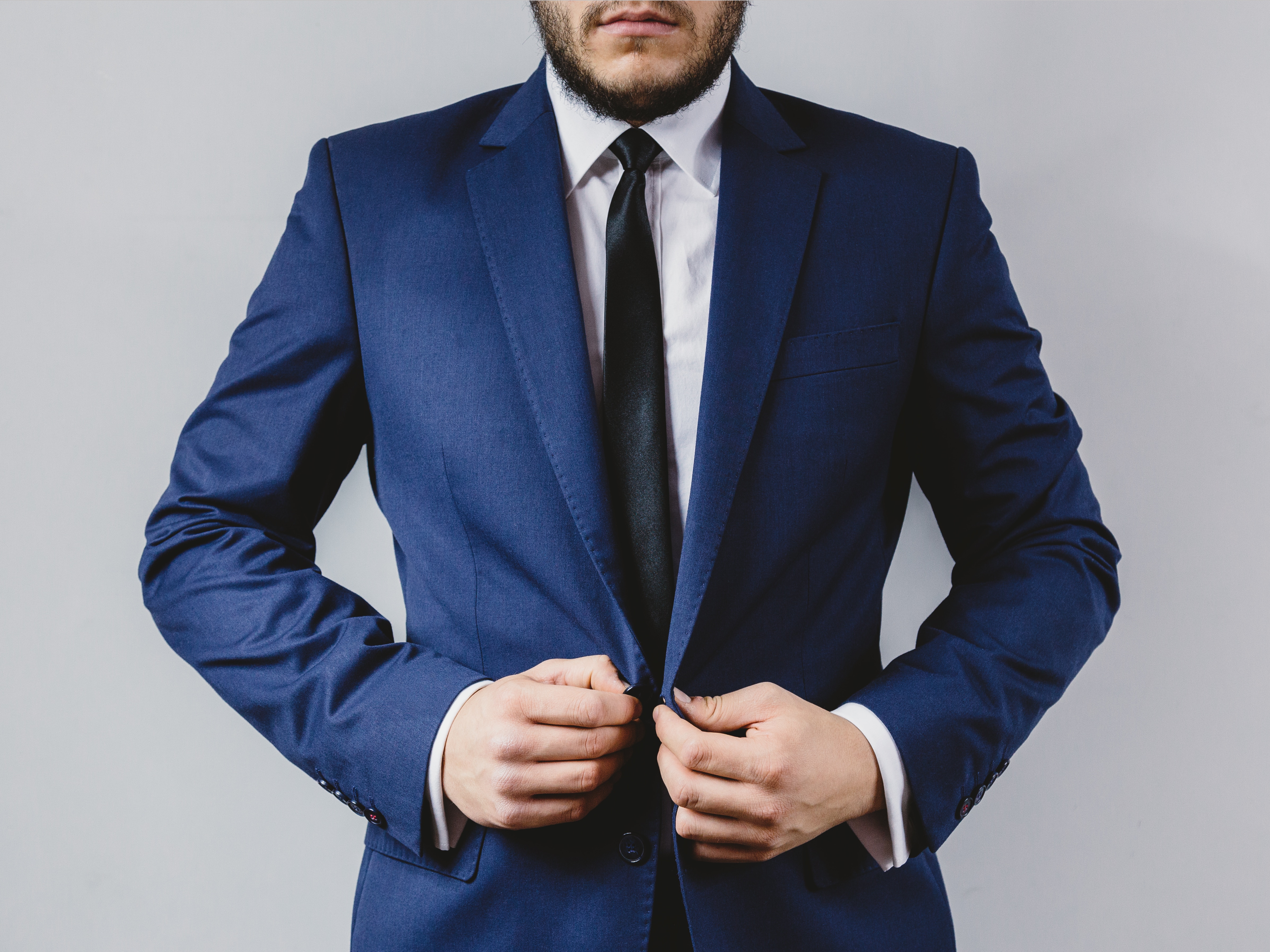 men's blue coat, white dress shirt and black necktie outfit