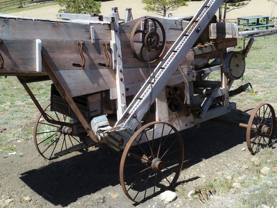 gray wooden wheeled machinery preview