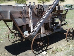 gray wooden wheeled machinery thumbnail