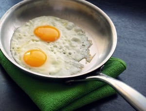 stainless steel skillet and 2 sunny side ups thumbnail