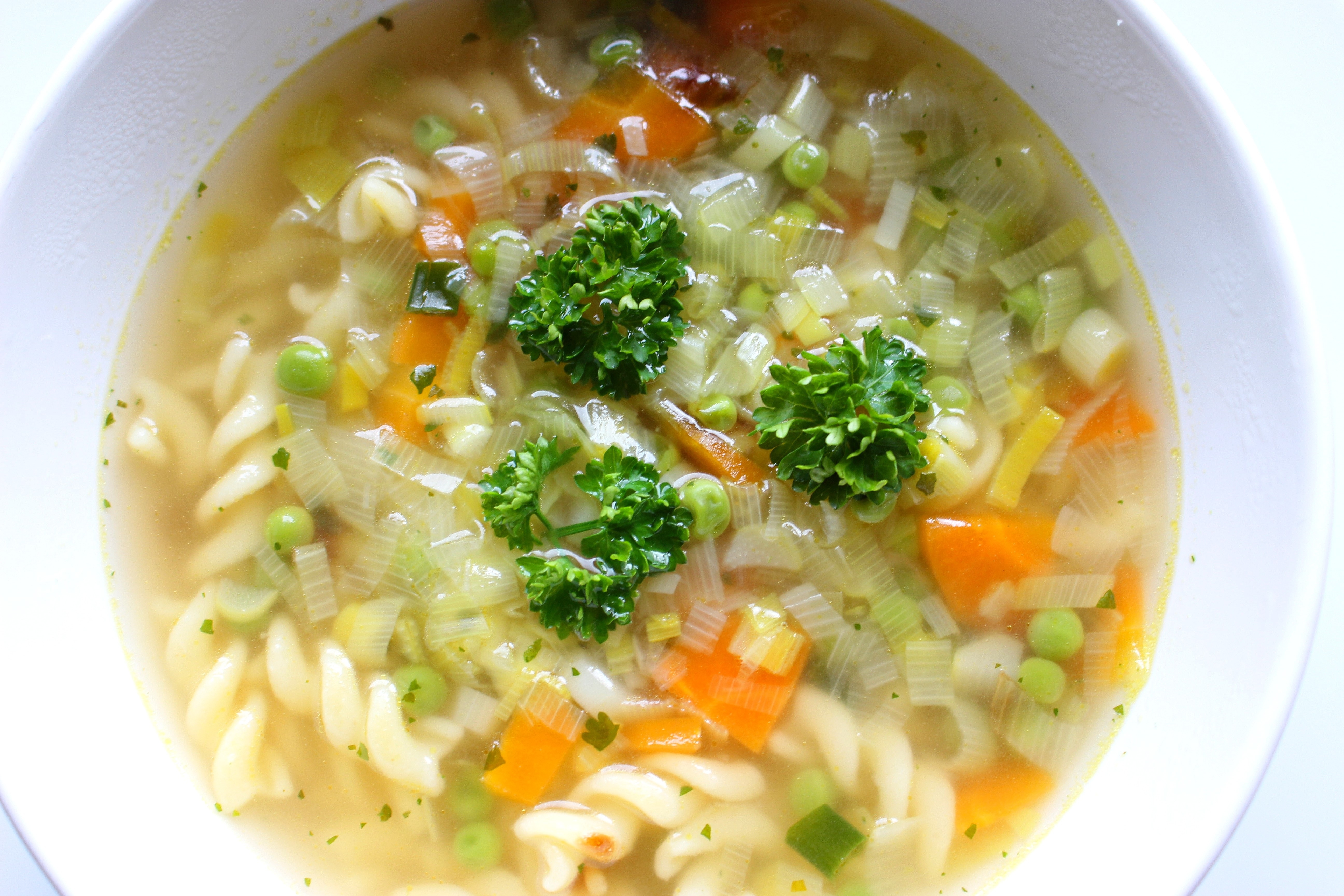 vegetable soup on white ceramic bowl