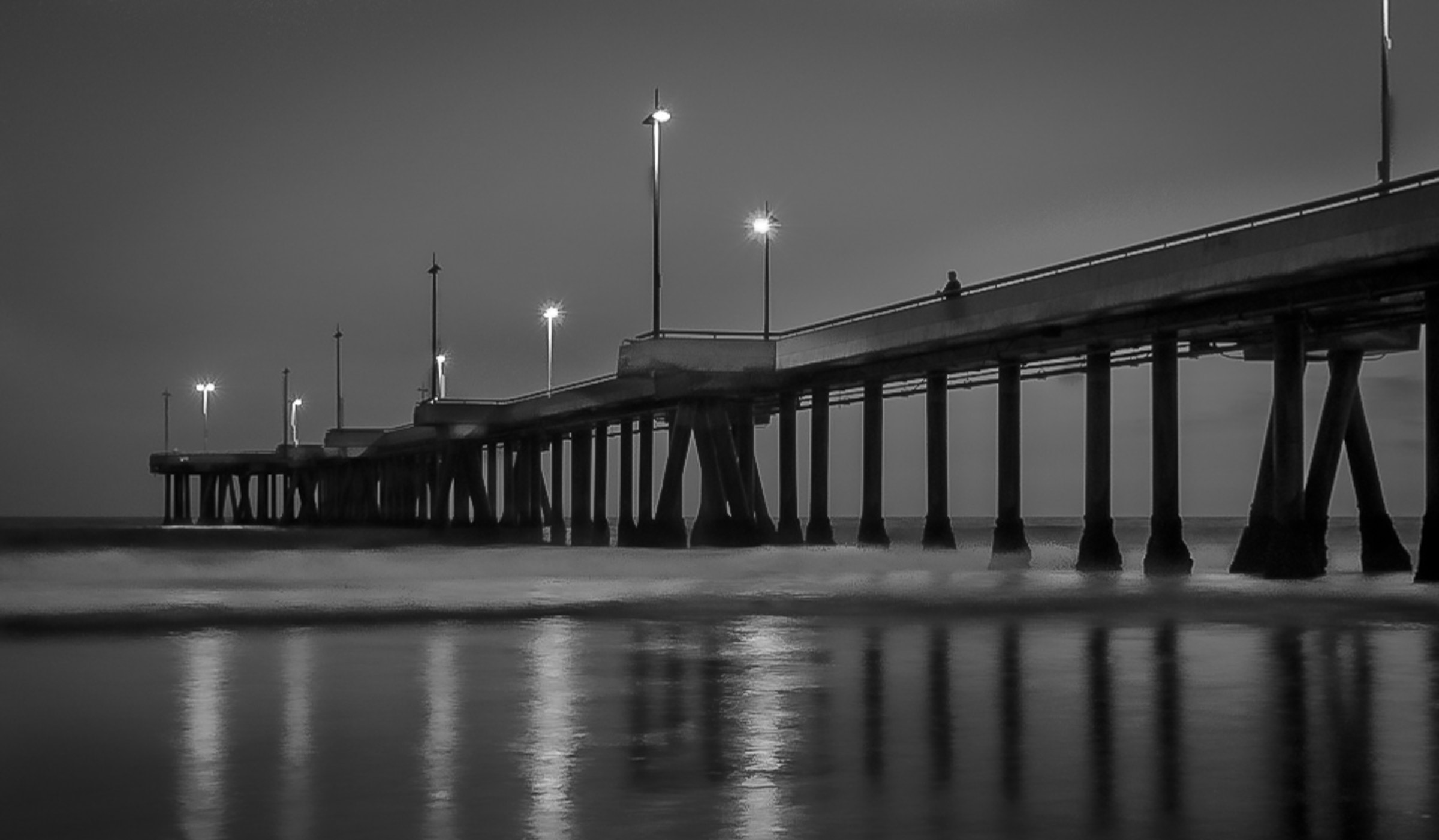 gray scale photograph of pier