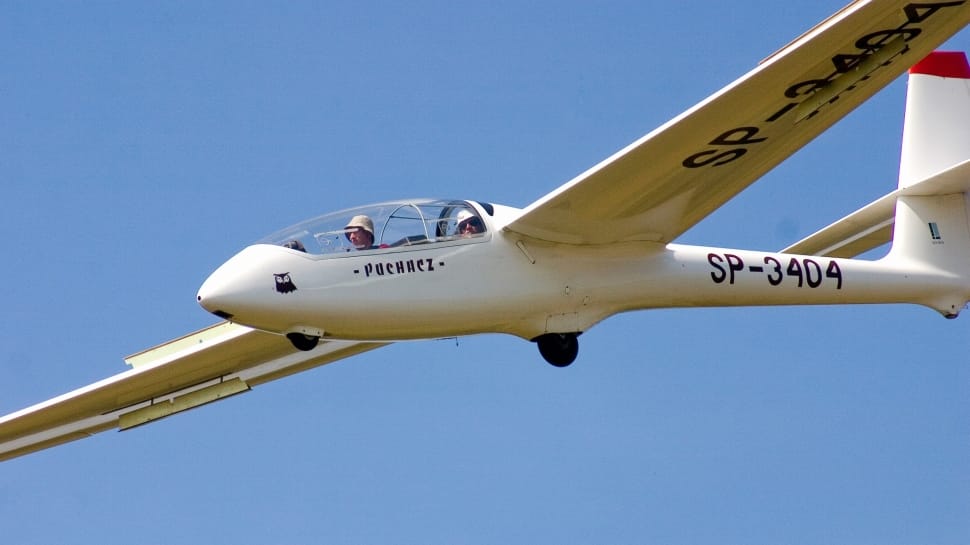 white aircraft with pilot preview