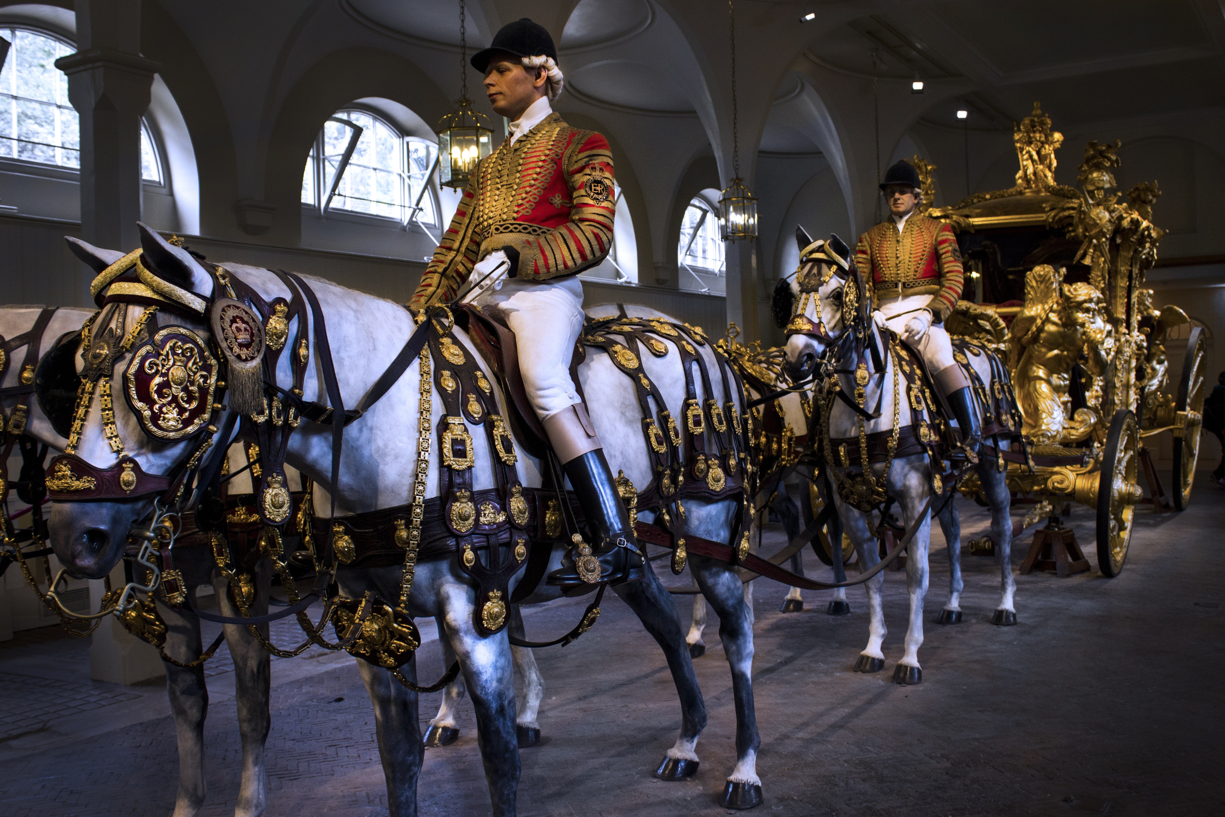 white horses with gold carriage
