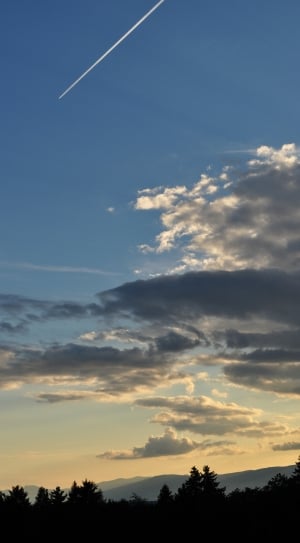 view of jetplane line on sky and clouds thumbnail