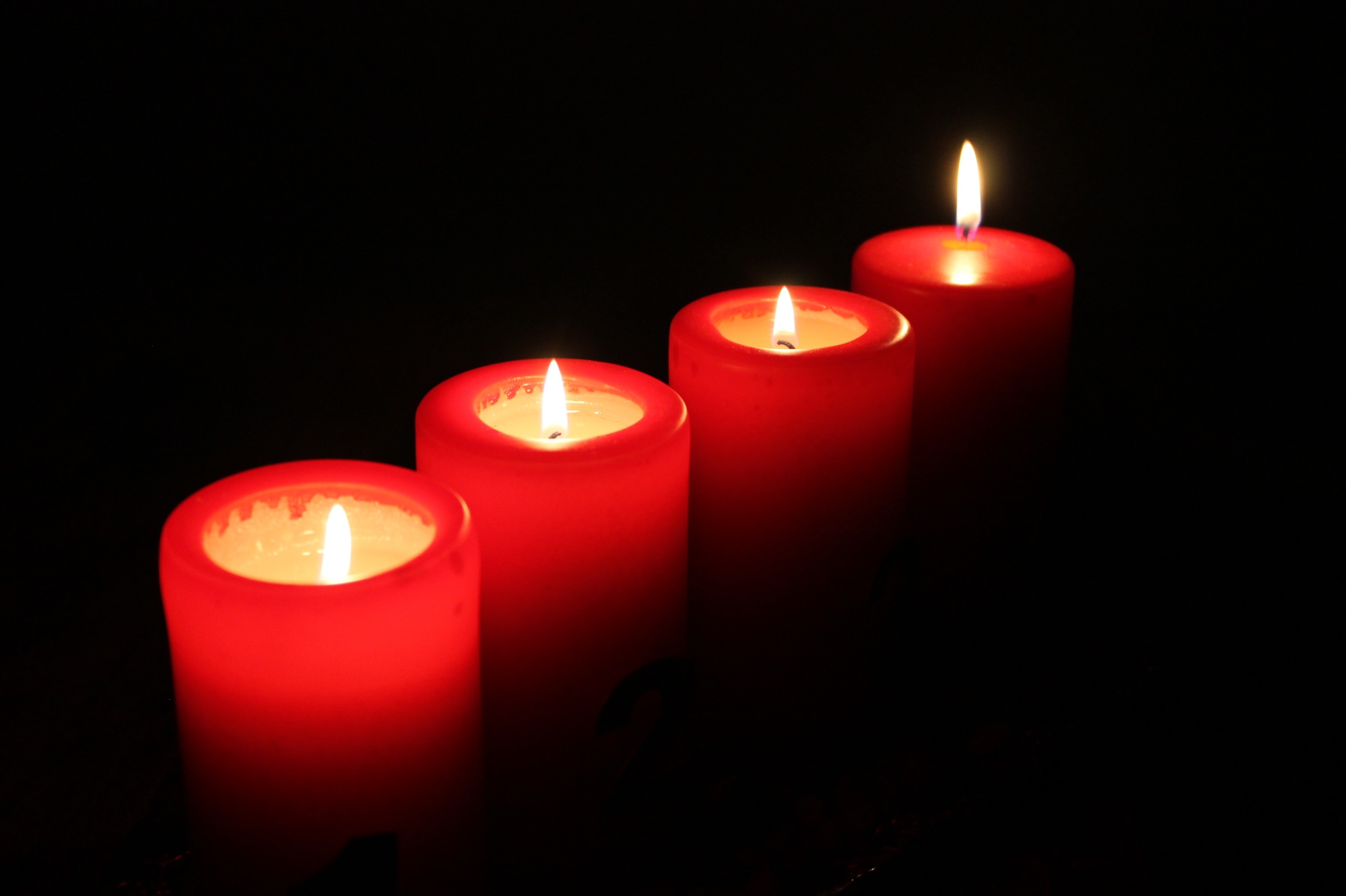 four red wax candles