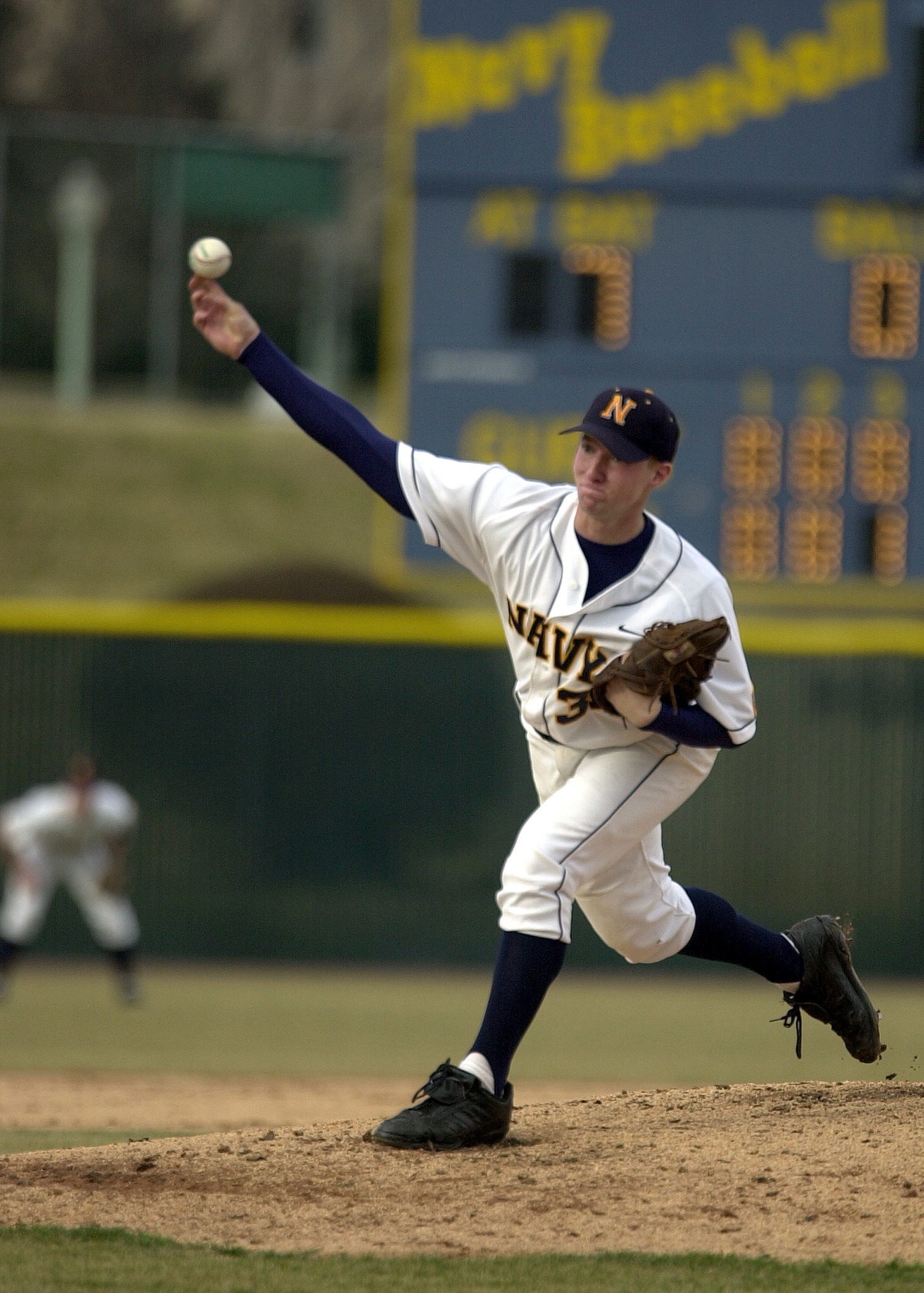 Navy Baseball player running to catch ball