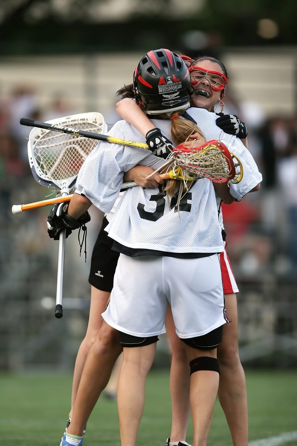 lacrosse players hugging preview