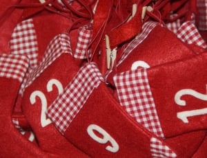 red and white textile with numbers thumbnail