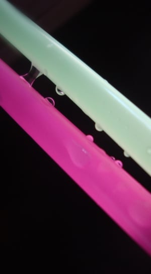 pink and green plastic straw with water droplets thumbnail