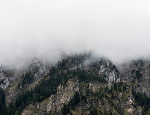aerial photography of mountains with clouds thumbnail
