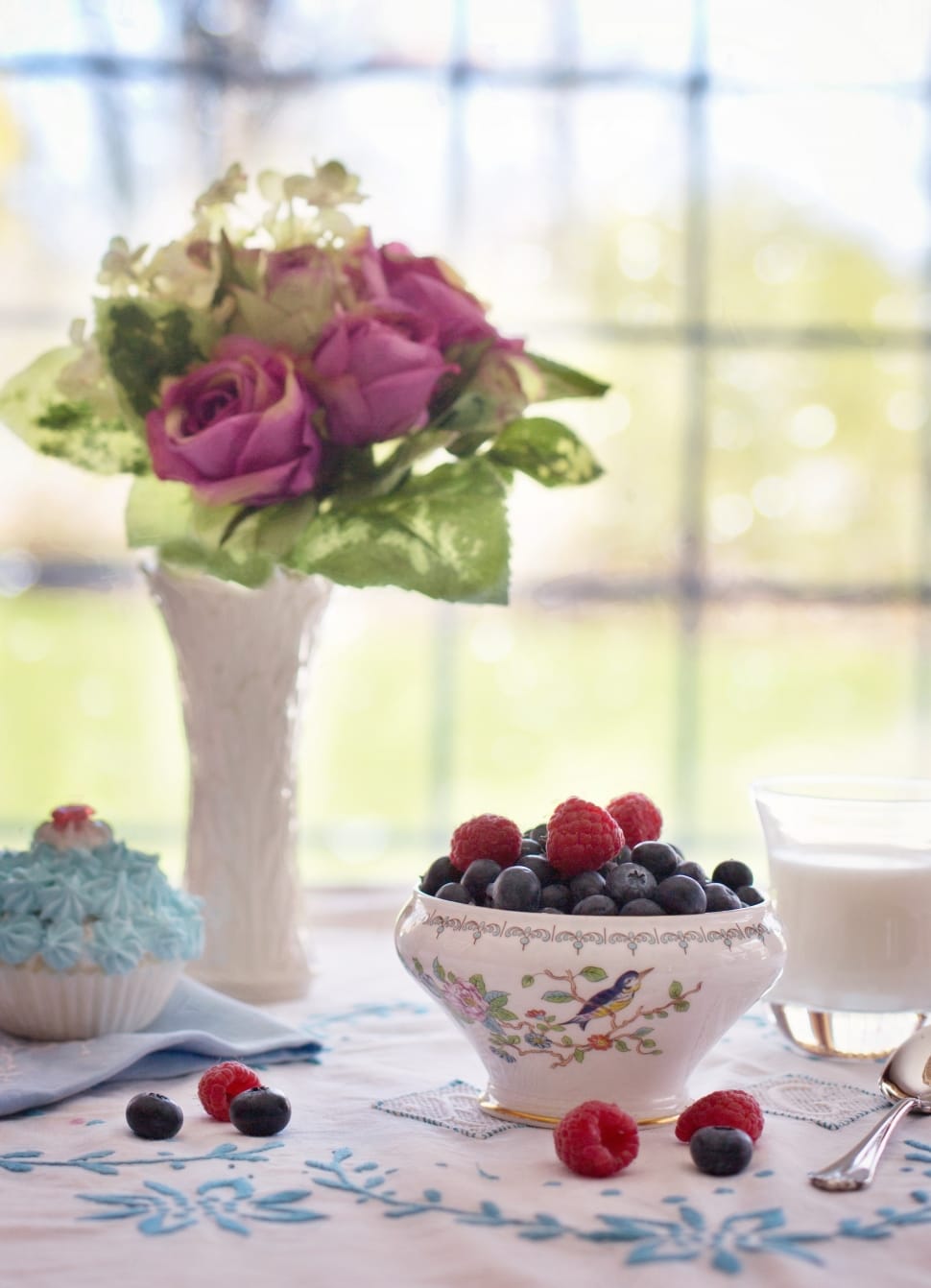 raspberry and blueberry in white ceramic flora bowl preview