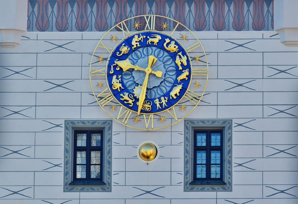 brass and blue round horoscole analog clock preview