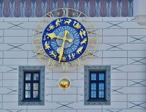 brass and blue round horoscole analog clock thumbnail