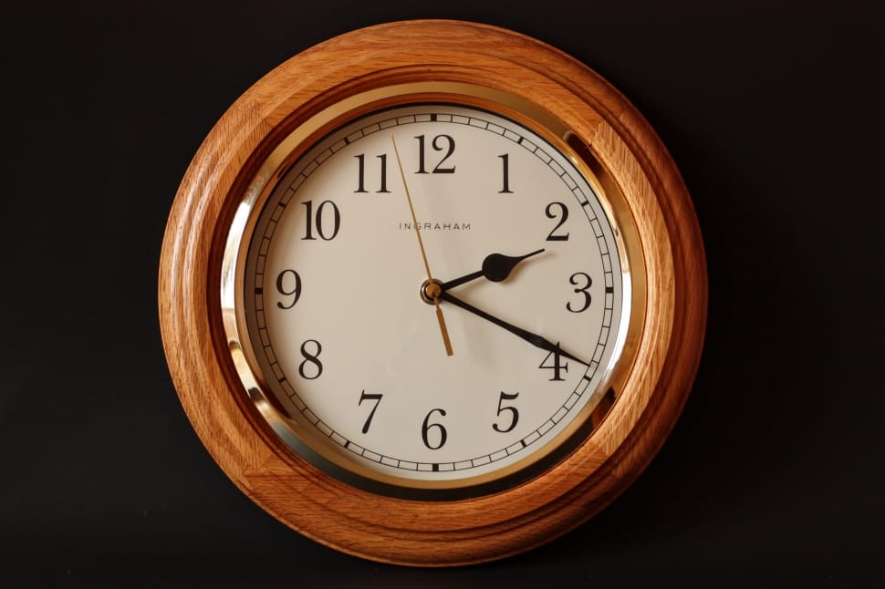 brown and white wooden round wall clock at 2:19 preview