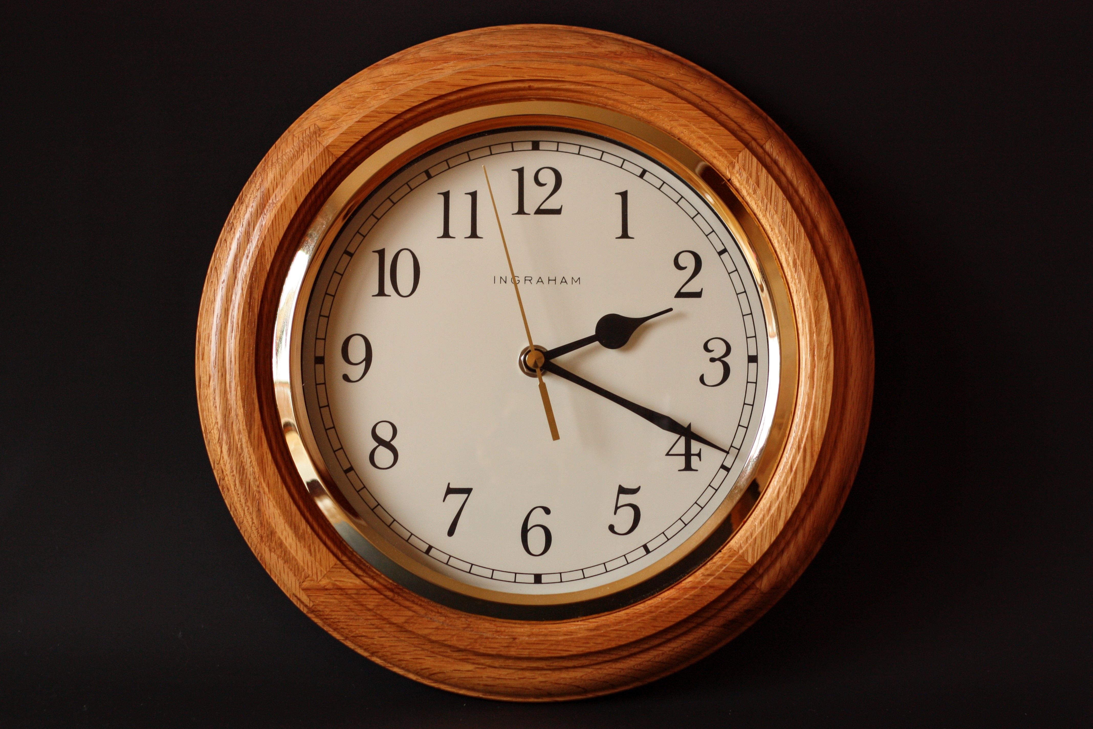 brown and white wooden round wall clock at 2:19