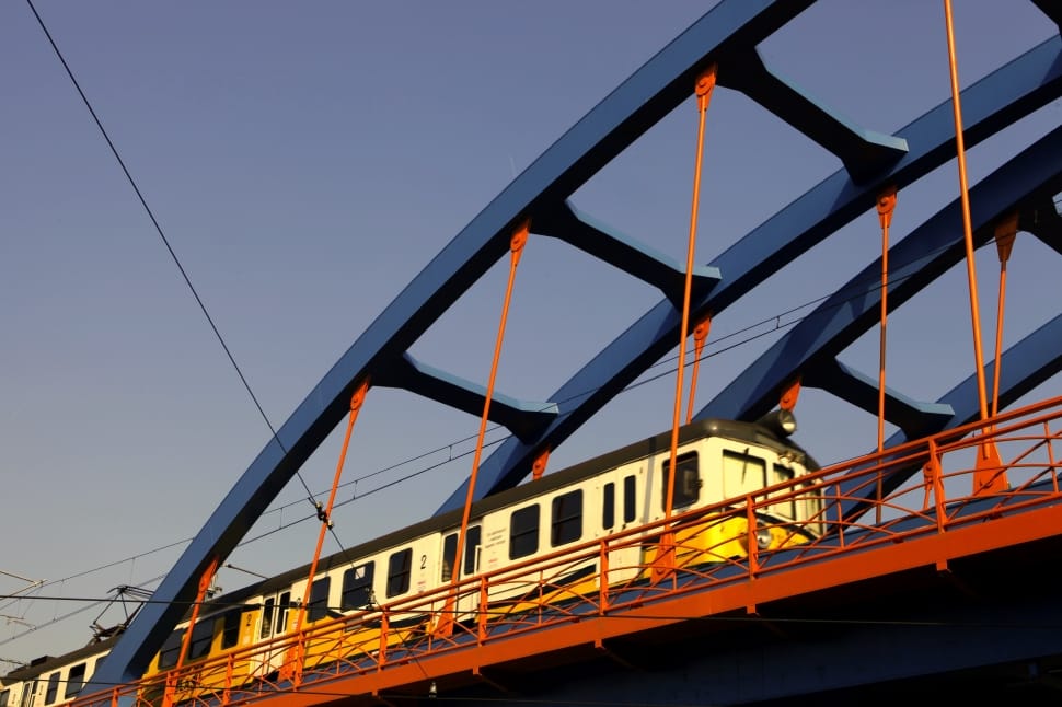 train crossing on gray metal bridge rail preview