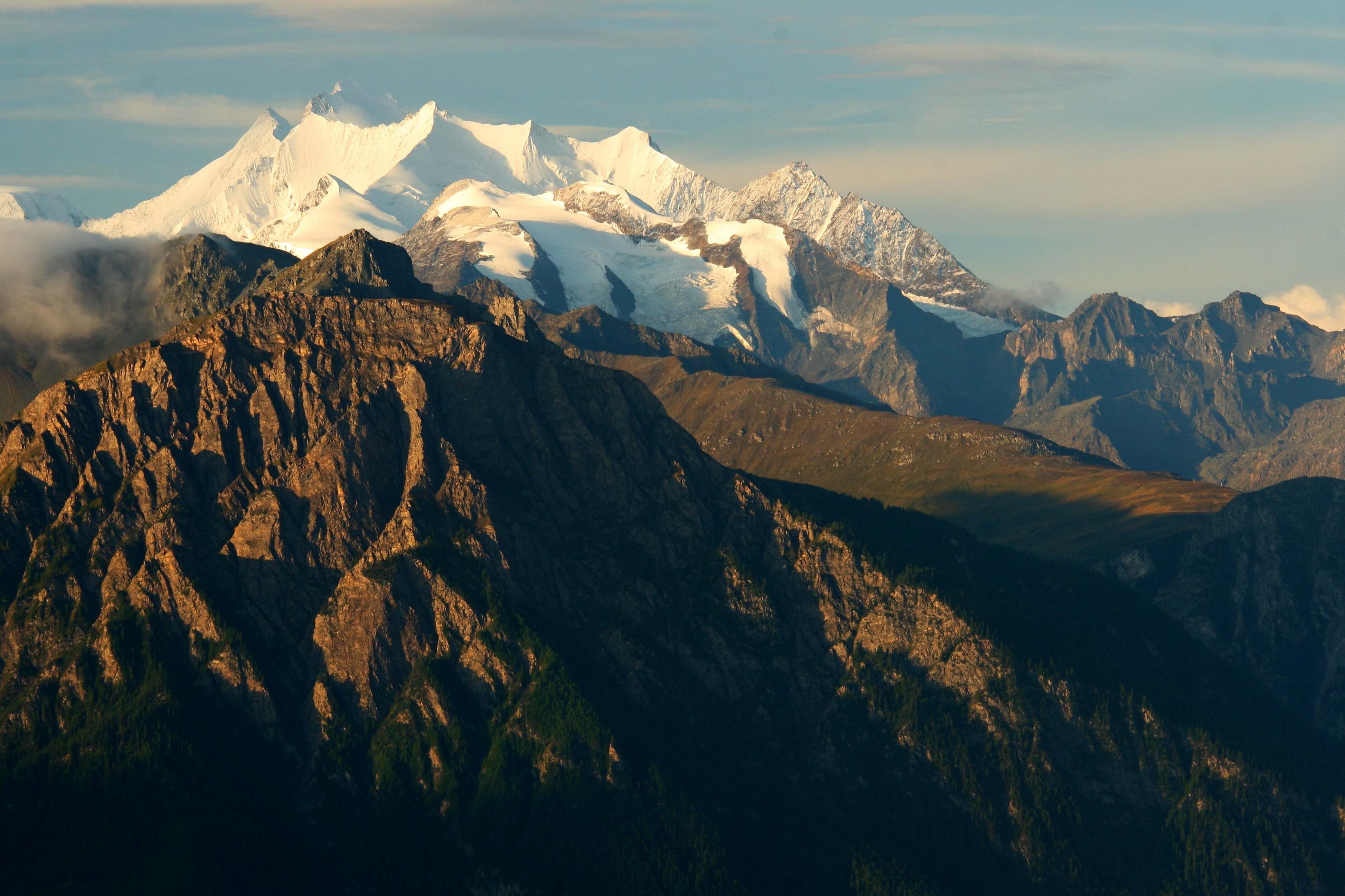 brown mountain across glacier mountain