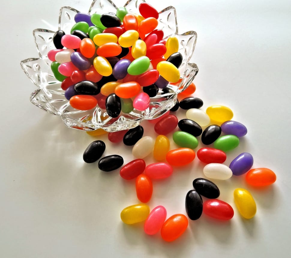 assorted color jelly beans on clear cut crystal glass bowl preview