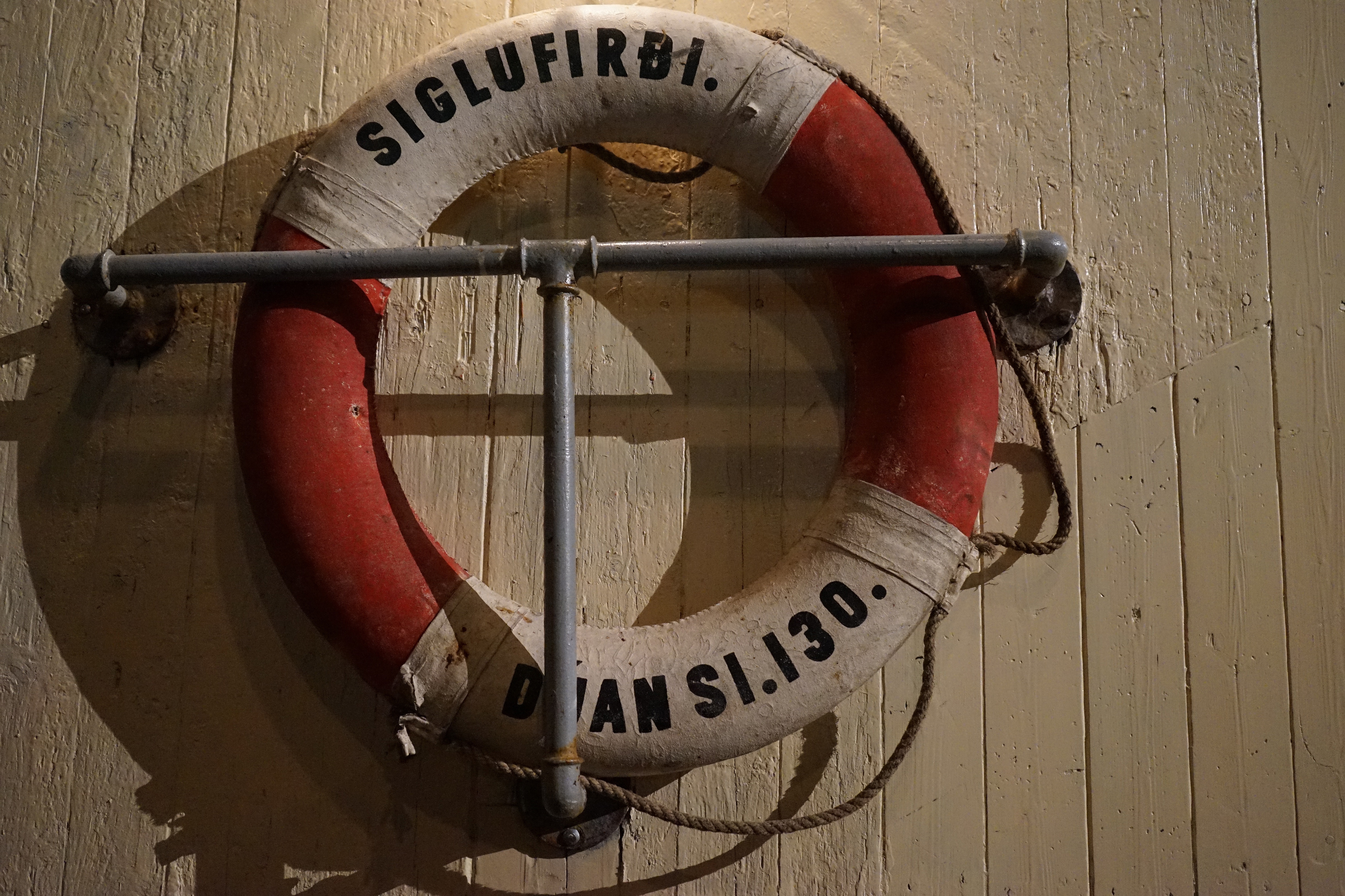 red and white Siglufirdi buoy