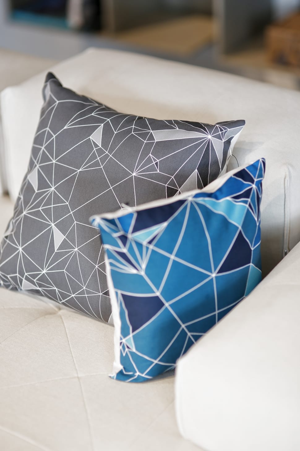 two gray and blue throw pillows preview