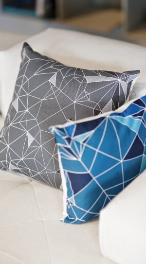 two gray and blue throw pillows thumbnail