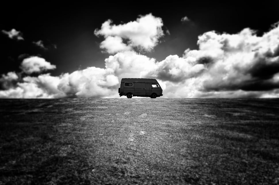 silhouette of van under cloudy sky preview