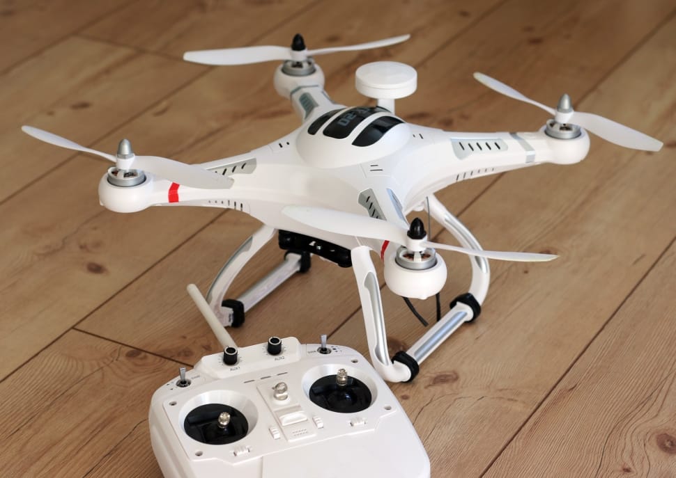 white and black quadcopter drone preview