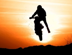silhouette photo of man riding motorcycle thumbnail
