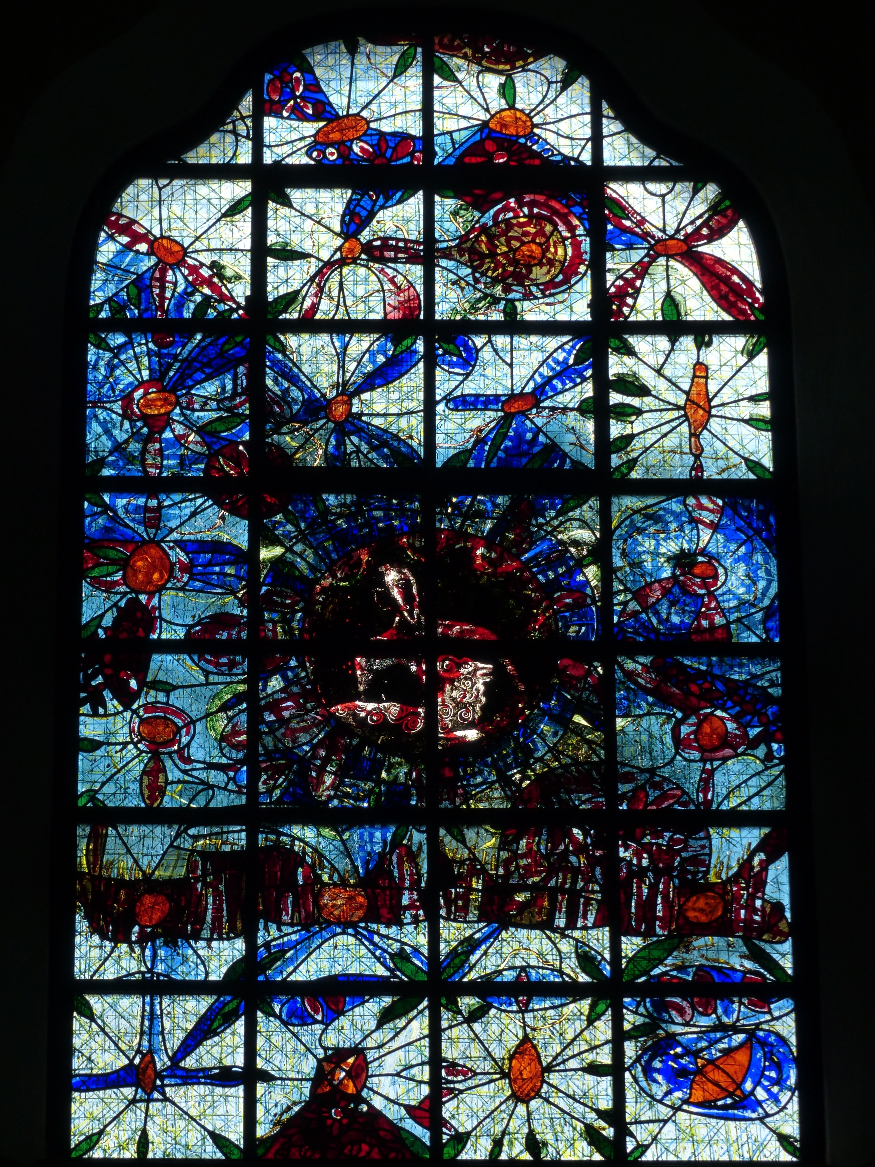 blue white and red floral tiffany glass window