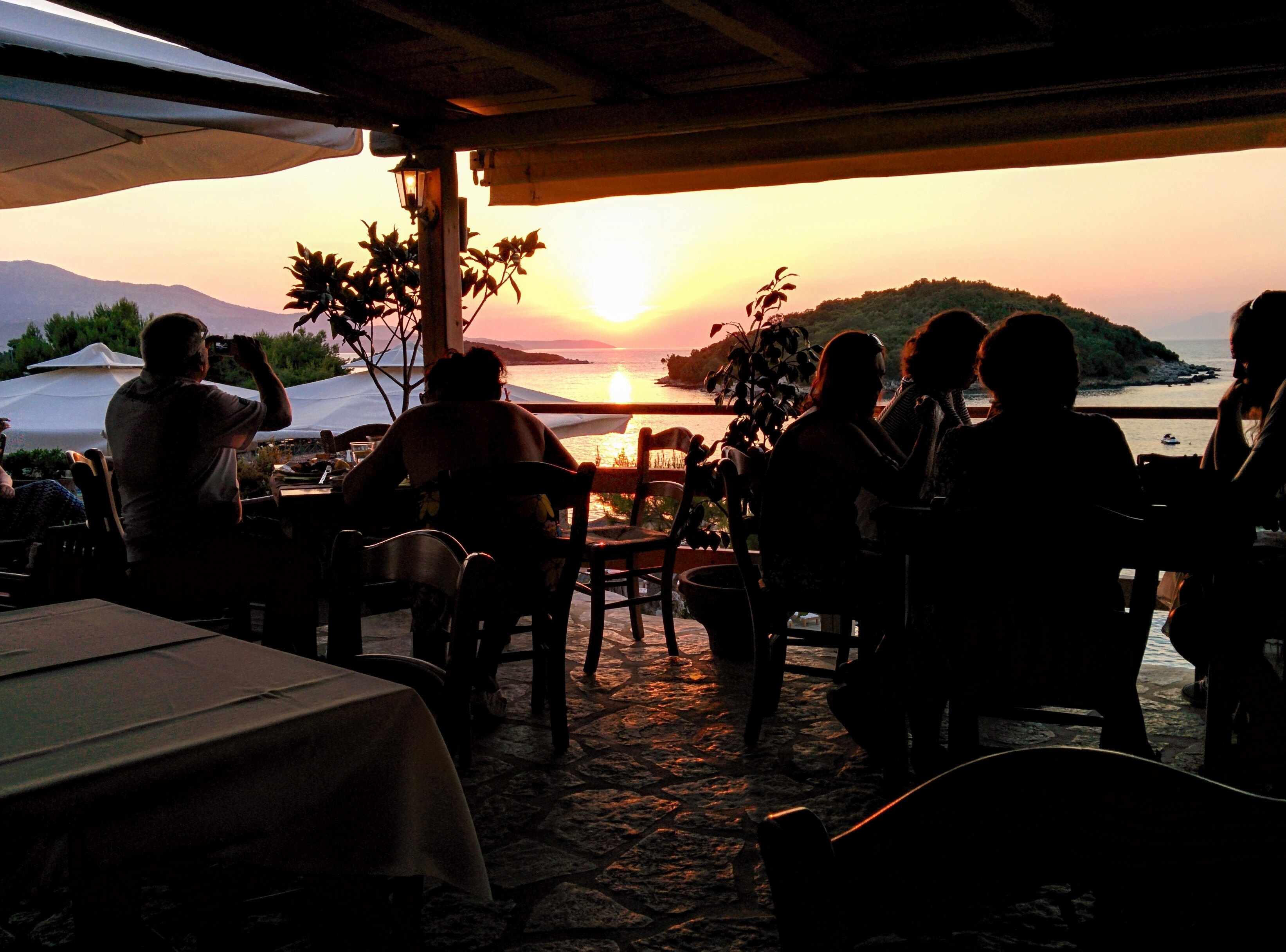 silhouette photo in restaurant with island over viewing