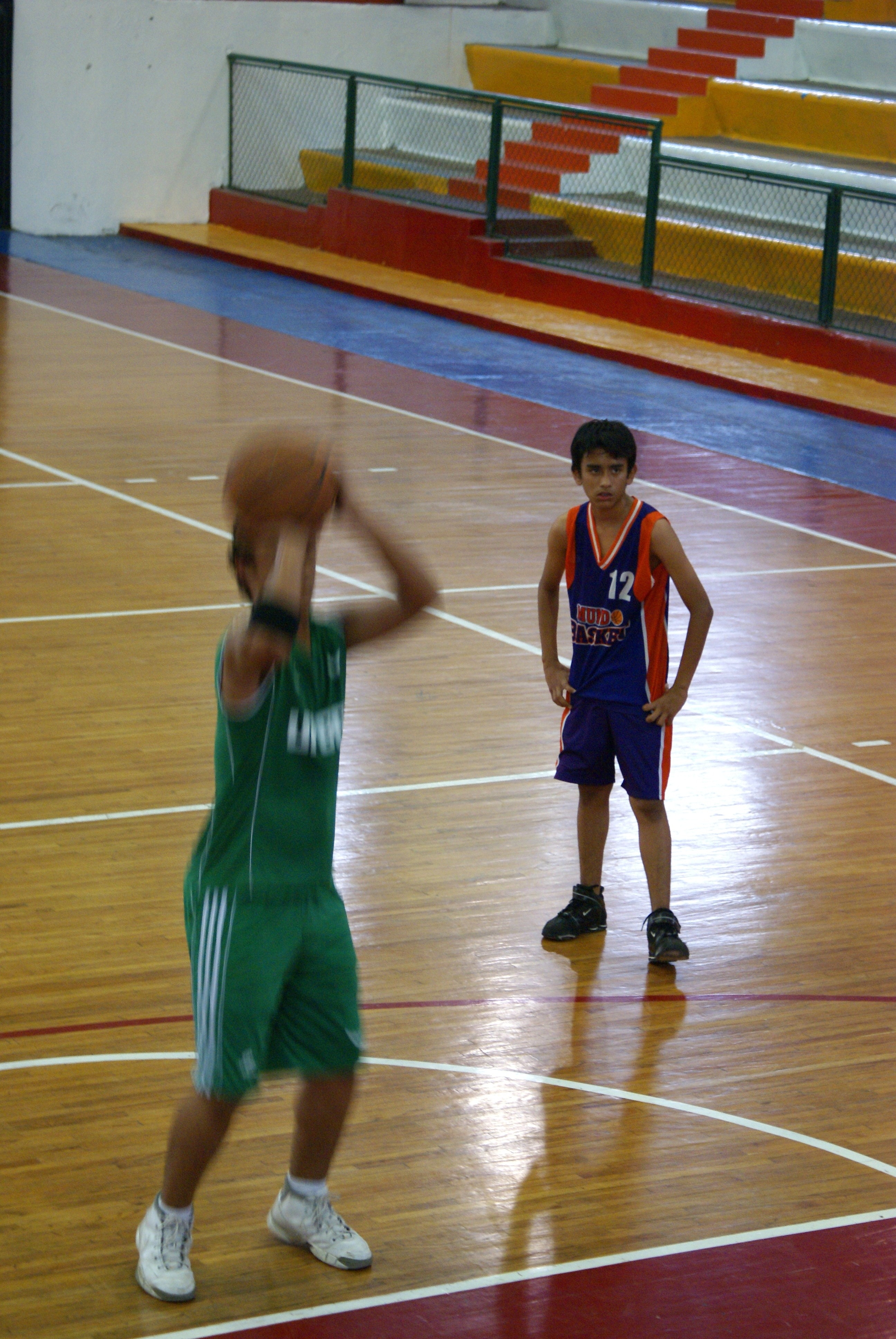 boy's blue and red basketball jersey