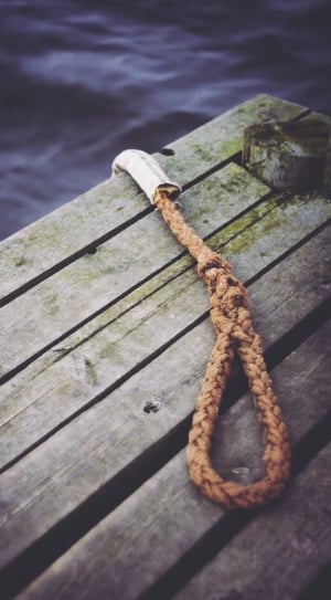 brown rope on grey wooden surface thumbnail