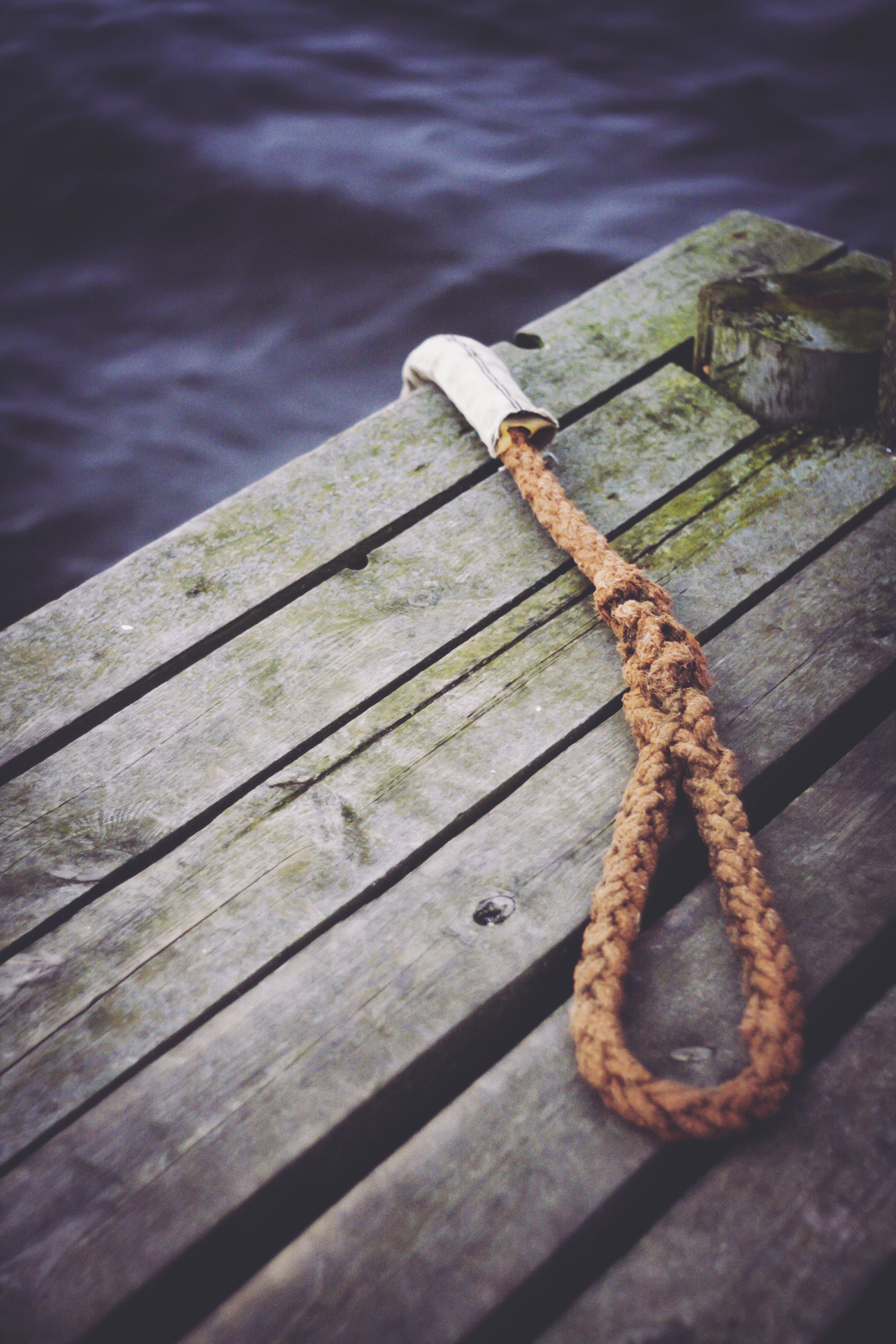 brown rope on grey wooden surface