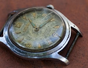 silver round analog watch thumbnail