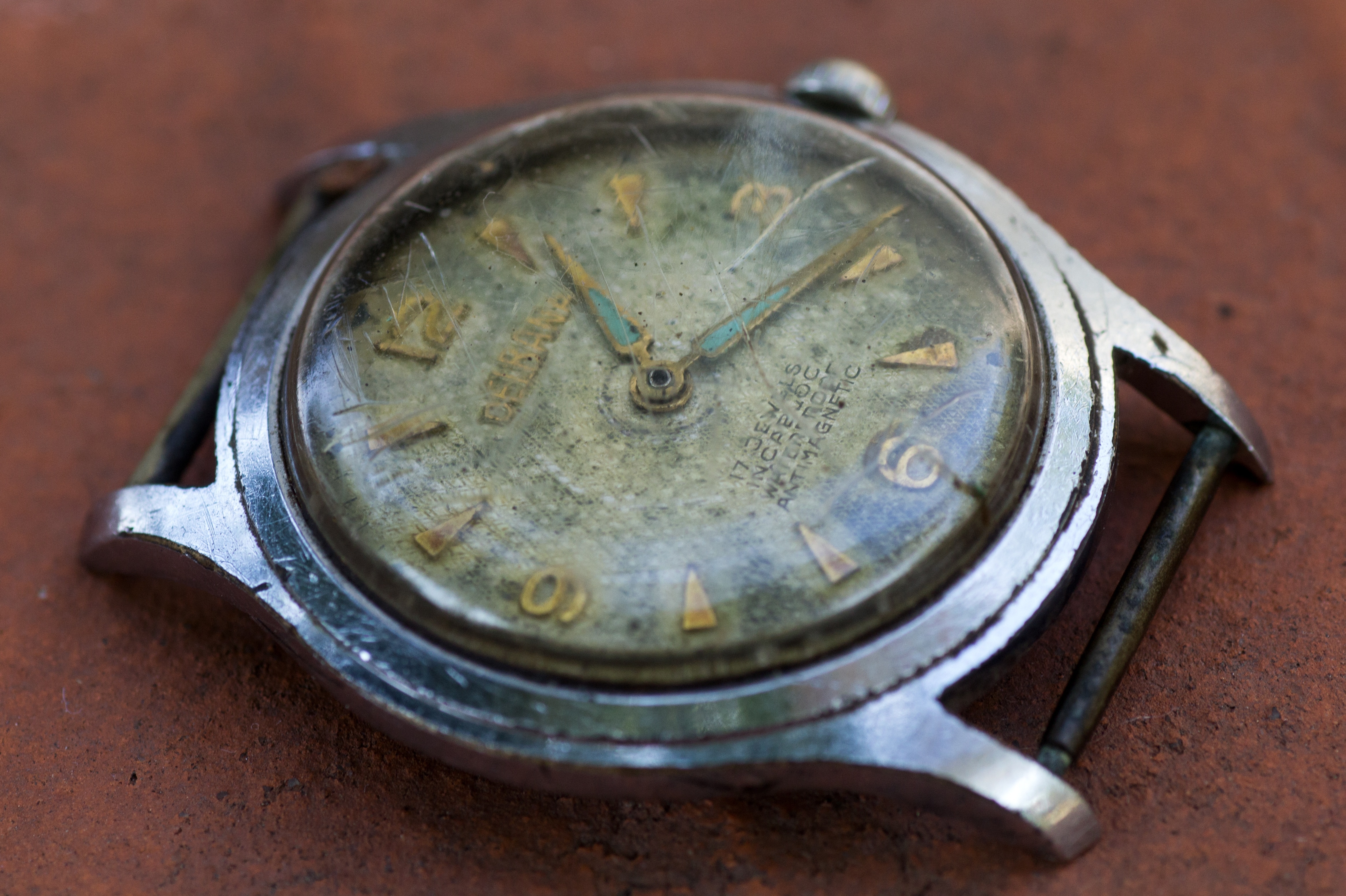 silver round analog watch