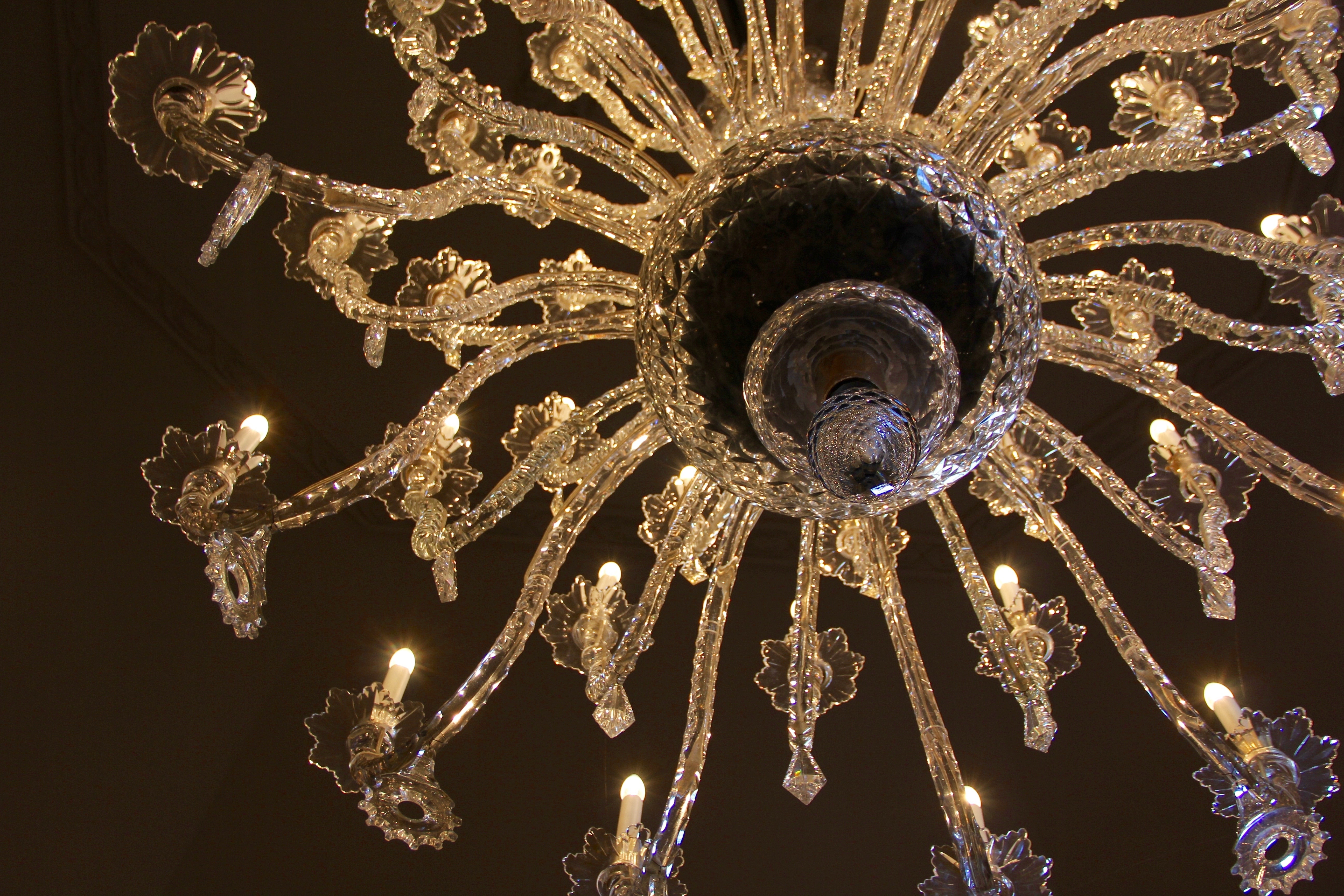 low angle view photography of gold-colored metal framed crystal chandelier
