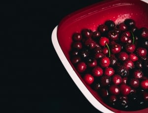 cherries  on red plastic bowl thumbnail