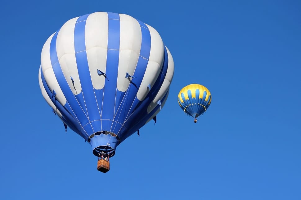 2 white blue and yellow hot air balloons preview