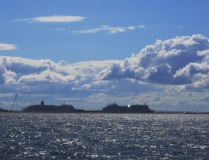 large ship in ocean under blue sky thumbnail