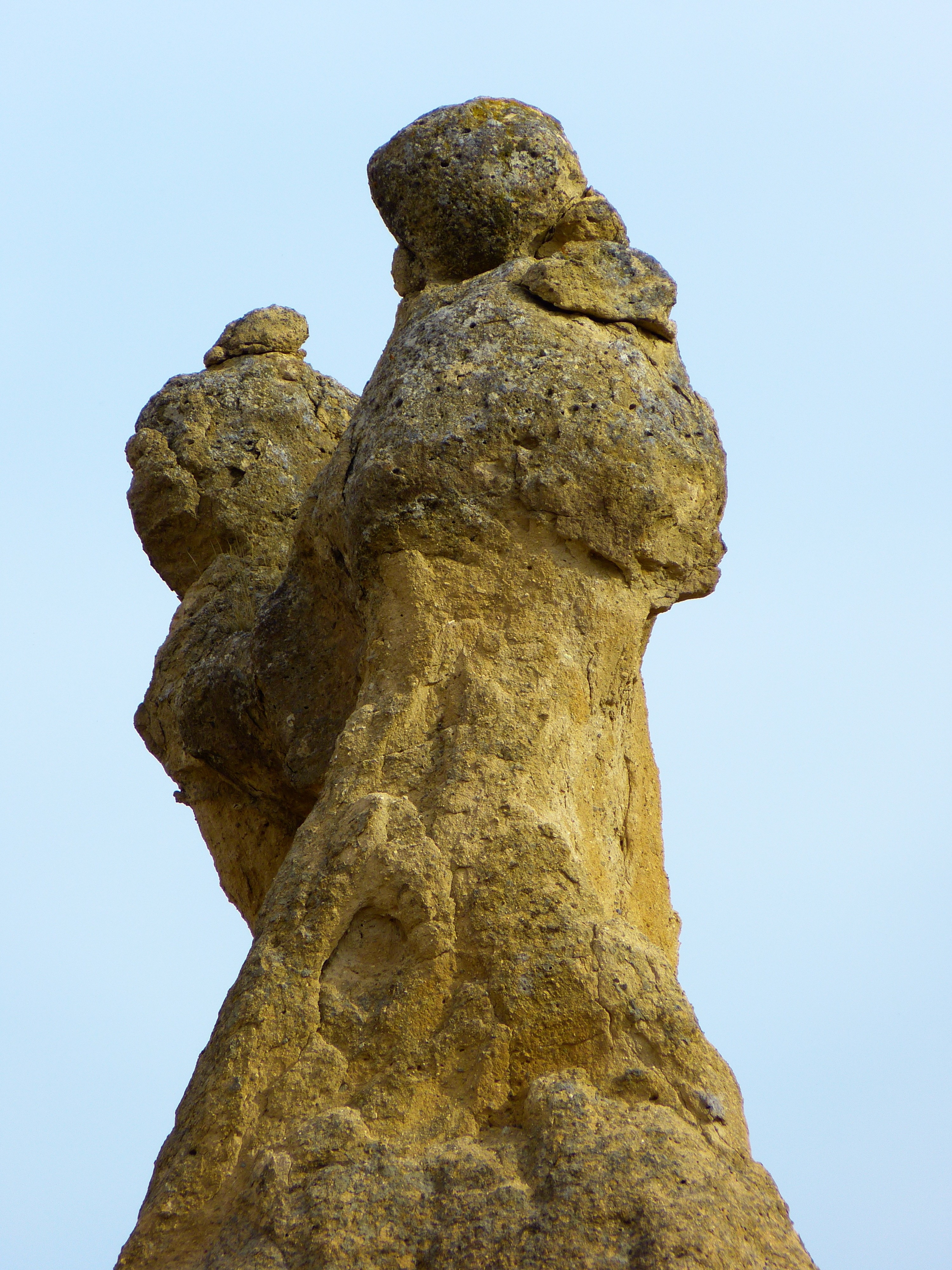 two brown and black rock figurine